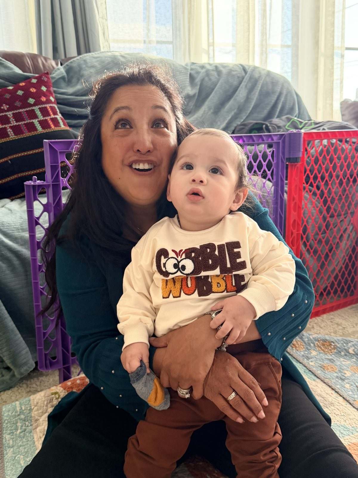 Roianne and Theodore in a Thanksgiving onesie